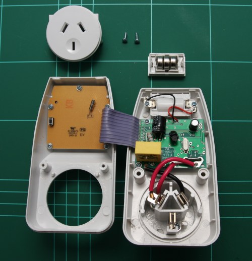 Power meter internals. Current measuring shunt on the bottom right of the green PCB.